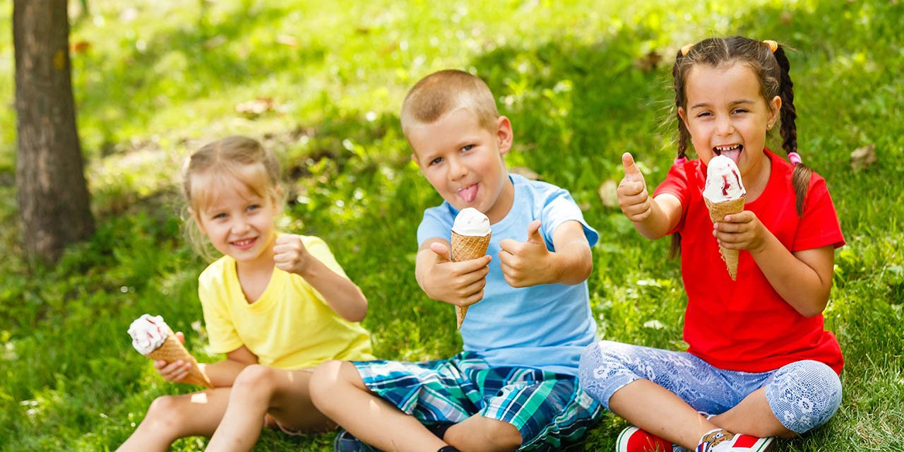 kids eating ice cream on the lawn